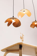 Modern pendant lights with wooden design on a white background