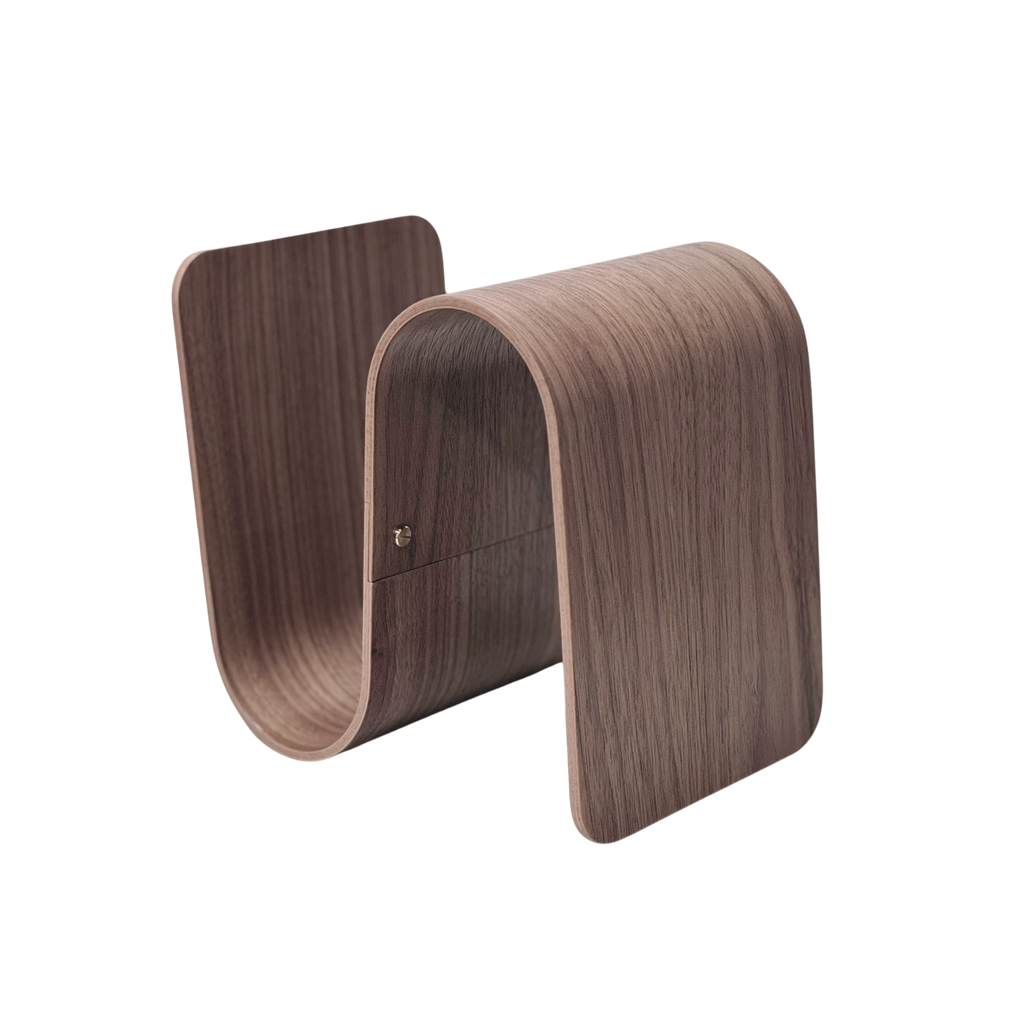 Wooden bookend with a curved design on a white background