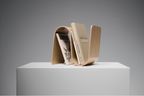 Wooden bookends holding two books on a gray background