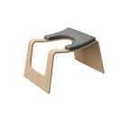 Modern design yoga headstand stool with wooden legs and gray seat on a white background